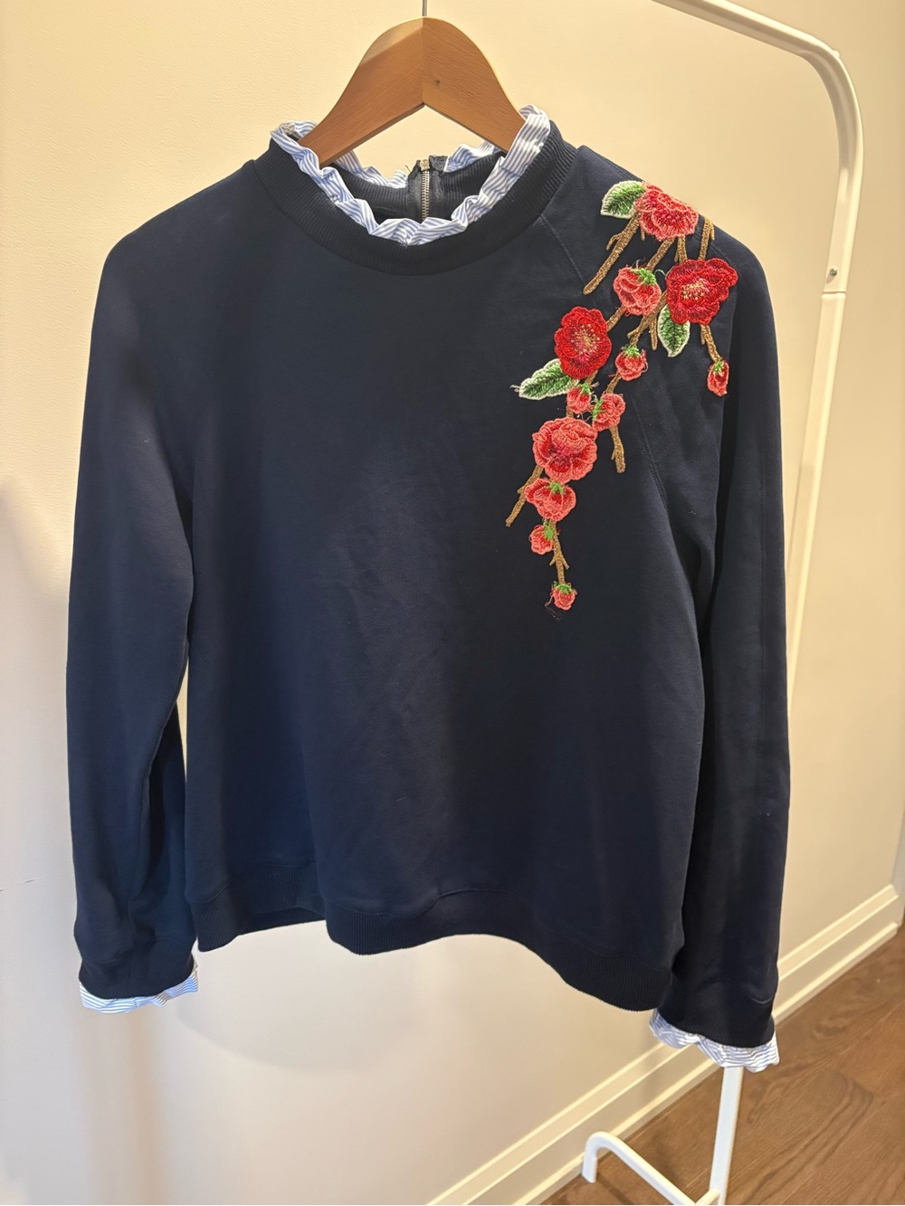 Navy Floral Embroidered Long-Sleeve Top with ruffle accents at neck and sleeves